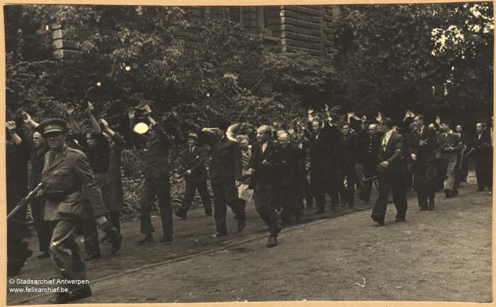 A procession of suspected collaborators