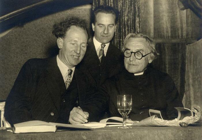 Rob Van Roosbroeck (left) and Jan Timmermans (centre), alongside the priest and chaplain Cyriel Verschaeve (right)