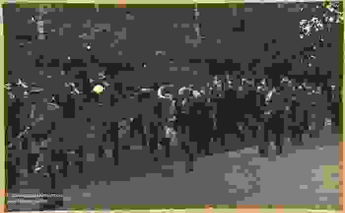 A procession of suspected collaborators