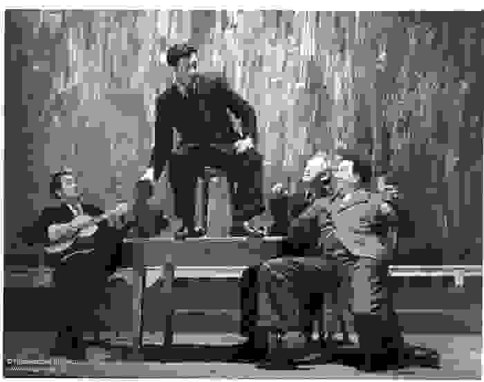 Actors on stage during a performance of Het Spel van Dr. Faust