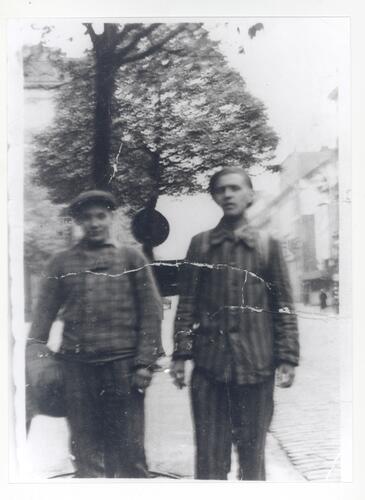 Two men in camp uniform