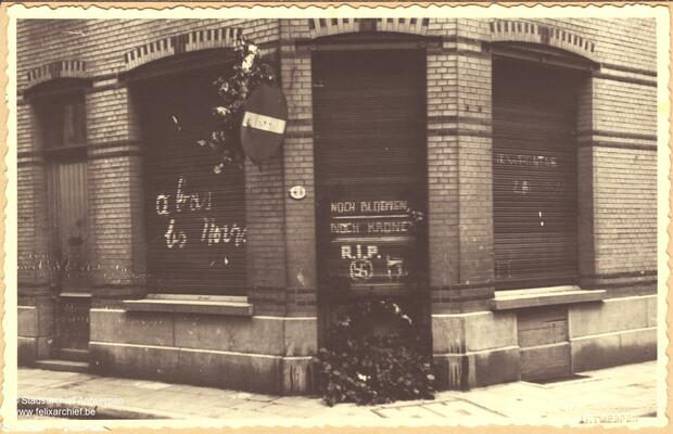 House daubed with graffiti reading 'A bas les noirs'