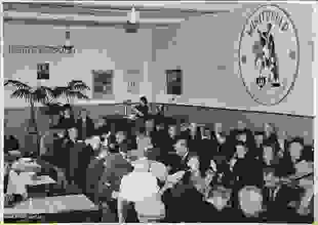 People eating in the Leopold III canteen set up by Winterhulp