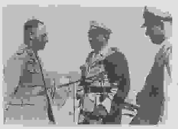 General Erwin Rommel facing two generals at El Alamein in Egypt