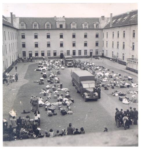 Jews reporting in the courtyard of the Dossin Barracks in Mechelen for compulsory work